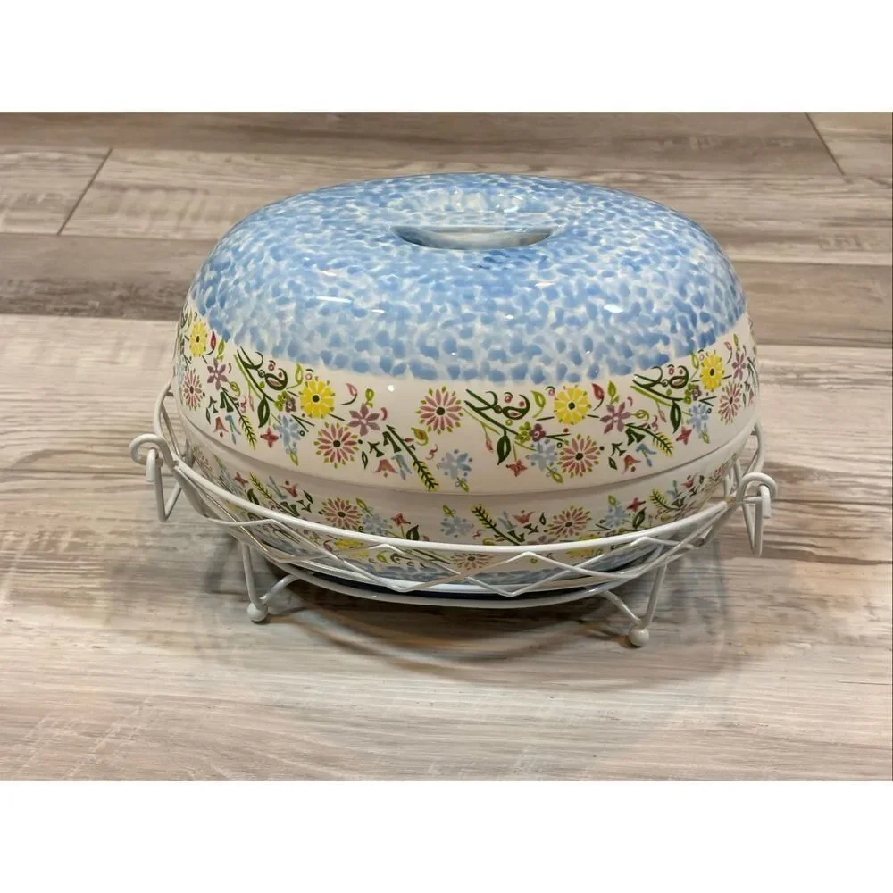Temp-tations Ovenware by Tara Blue oval covered casserole dish with a metal stan